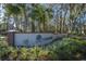 The Oak Bluff community entrance has a brick base and landscaping surrounding the sign at 8120 Shadow Oak Dr, North Charleston, SC 29406