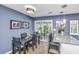 Cozy dining area adjacent to the kitchen with natural light and a view to the backyard at 8120 Shadow Oak Dr, North Charleston, SC 29406