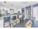Open kitchen featuring stainless steel appliances, granite countertops, dining table and staircase at 8120 Shadow Oak Dr, North Charleston, SC 29406