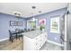 Bright kitchen featuring stainless steel appliances, granite countertops, and access to the backyard at 8120 Shadow Oak Dr, North Charleston, SC 29406