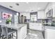 Modern kitchen featuring white cabinetry, granite countertops, and stainless steel appliances at 8120 Shadow Oak Dr, North Charleston, SC 29406