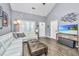 Comfortable living room with vaulted ceiling, white sectional sofa, and modern entertainment center at 8120 Shadow Oak Dr, North Charleston, SC 29406
