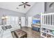 Bright living room with high ceilings, ample seating, and a modern entertainment setup at 8120 Shadow Oak Dr, North Charleston, SC 29406