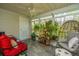Relaxing sunroom with ample seating, decorative plants, and plenty of natural light at 8120 Shadow Oak Dr, North Charleston, SC 29406