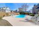 Large backyard with a pool, lounge chairs, mature trees, landscaping, and privacy fence at 904 Watermelon Run, Charleston, SC 29412