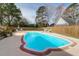 Backyard features a pool, brick patio, and privacy fence at 904 Watermelon Run, Charleston, SC 29412