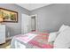 Neutral toned bedroom with a striped comforter, carpet and ensuite bath access at 904 Watermelon Run, Charleston, SC 29412