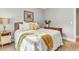 Bedroom with light tan walls, a comfy rattan bed, and natural light, creates a relaxing atmosphere at 904 Watermelon Run, Charleston, SC 29412