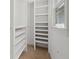 Bright closet with white shelving and neutral carpet under a window offers generous storage space at 904 Watermelon Run, Charleston, SC 29412