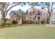 Charming brick two-story home with a well-manicured lawn and mature trees in a desirable neighborhood at 904 Watermelon Run, Charleston, SC 29412