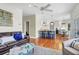 Bright open-concept living space connected to the kitchen, featuring hardwood floors and stylish decor at 904 Watermelon Run, Charleston, SC 29412