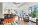 Open living area with kitchen views, featuring hardwood floors, neutral paint, and french doors to the yard at 904 Watermelon Run, Charleston, SC 29412