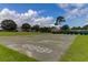 Community playground features a hopscotch court, basketball court, and open green space perfect for recreation at 904 Watermelon Run, Charleston, SC 29412
