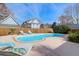 Backyard pool area features chaise lounges and privacy fence at 904 Watermelon Run, Charleston, SC 29412