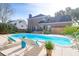 Backyard pool area features a spacious deck, lounge chairs, and a privacy fence at 904 Watermelon Run, Charleston, SC 29412