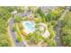 Aerial view of the community pool with ample seating, playground, and parking at 9981 Winged Elm St, Ladson, SC 29456