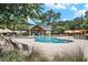 Community pool with ample lounge seating and umbrellas around the pool at 9981 Winged Elm St, Ladson, SC 29456