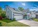 Charming two-story home with attached garage and landscaped yard at 9981 Winged Elm St, Ladson, SC 29456