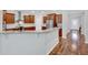 Open concept kitchen with stainless steel appliances and granite countertops at 9981 Winged Elm St, Ladson, SC 29456