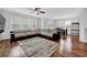 Bright living room features a large sectional sofa, hardwood floors and a dining area at 9981 Winged Elm St, Ladson, SC 29456