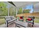 Screened in patio with outdoor furniture and view of backyard at 9981 Winged Elm St, Ladson, SC 29456