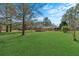 Extensive backyard featuring a well-maintained lawn, utility shed, and mature trees at 102 Wright Ln, Goose Creek, SC 29445