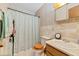 Bright bathroom featuring vintage tile, fixtures, and wallpaper at 102 Wright Ln, Goose Creek, SC 29445