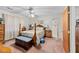 Comfortable bedroom featuring a four-poster bed and an adjacent bathroom at 102 Wright Ln, Goose Creek, SC 29445