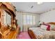 Bedroom with floral wallpaper, bed, dresser, and a light-filled window at 102 Wright Ln, Goose Creek, SC 29445