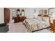 Spacious bedroom featuring furniture, comfortable bed, and an open doorway at 102 Wright Ln, Goose Creek, SC 29445
