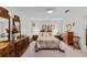 Bright bedroom featuring a large bed, dresser, and bedside tables with lamps at 102 Wright Ln, Goose Creek, SC 29445