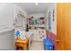 Functional laundry room equipped with washer, dryer, utility sink and ample shelving at 102 Wright Ln, Goose Creek, SC 29445
