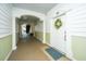 Well-maintained hallway featuring white trim, unit door, and stairway at 1025 Riverland Woods Pl # 801, Charleston, SC 29412