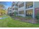 Beautiful condo building with lush lawns, gated entrances, and relaxing screened in balconies for outdoor living at 1025 Riverland Woods Pl # 801, Charleston, SC 29412