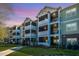 Charming condo building featuring large screened porches and lush landscaping, perfect for enjoying the outdoors at 1025 Riverland Woods Pl # 801, Charleston, SC 29412