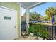 Charming front porch with potted plants and view of parking lot at 1025 Riverland Woods Pl # 801, Charleston, SC 29412