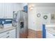Kitchen with stainless refrigerator and white cabinets at 1025 Riverland Woods Pl # 801, Charleston, SC 29412