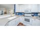 Well-equipped kitchen with white appliances and ample counter space at 1025 Riverland Woods Pl # 801, Charleston, SC 29412
