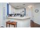 Bright kitchen with white cabinets, stainless steel appliances, and a breakfast bar at 1025 Riverland Woods Pl # 801, Charleston, SC 29412