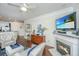 Comfortable living room open to kitchen features hardwood floors, fireplace, and stylish décor for relaxation and entertaining at 1025 Riverland Woods Pl # 801, Charleston, SC 29412