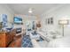 Inviting living room with cozy fireplace, comfortable seating, and balcony access, perfect for relaxing and entertaining at 1025 Riverland Woods Pl # 801, Charleston, SC 29412