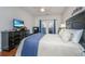 Bedroom with wood floors and TV at 1025 Riverland Woods Pl # 801, Charleston, SC 29412