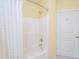 Bright shower features a white shower curtain, white tiles, and a white door at 1025 Riverland Woods Pl # 801, Charleston, SC 29412