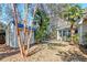Spacious backyard featuring a storage shed, lush landscaping, and plenty of room for outdoor activities and relaxation at 106 Sago Palm Ct, Summerville, SC 29483
