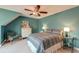 Comfortable bedroom featuring blue walls, a ceiling fan, and a cozy bed at 106 Sago Palm Ct, Summerville, SC 29483
