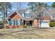 Charming two-story brick home with teal shutters and a well-manicured front yard at 106 Sago Palm Ct, Summerville, SC 29483