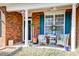 Cozy front porch with seating, planters, and a ceiling fan, offering a warm welcome at 106 Sago Palm Ct, Summerville, SC 29483