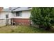 Back exterior of home, showing siding and brick at 107 Grant St, Walterboro, SC 29488