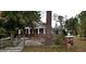 Charming brick home with a small front porch and fenced yard at 107 Grant St, Walterboro, SC 29488