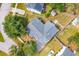 An aerial view of a home showing the roof, solar panels, yard, and surrounding neighborhood at 1079 Lockhart St, North Charleston, SC 29405